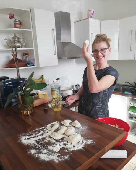 Natalia making pierogi in her kitchen